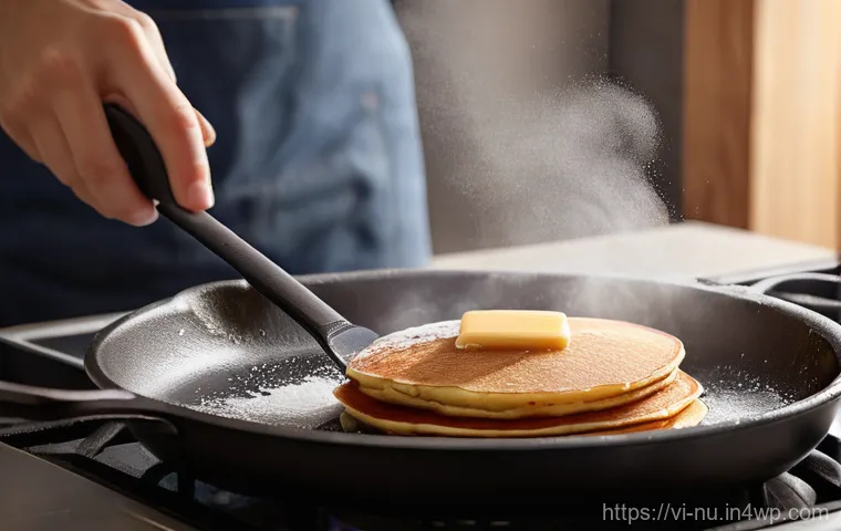 캐나다식 팬케이크 기본 레시피 - **Golden Fluffy Pancake Flip in a Cozy Kitchen**
    A close-up, dynamic shot of a perfectly golden-...